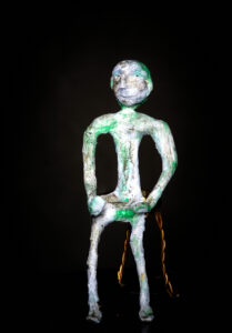 'I am' tissue paper figure on wire stool
